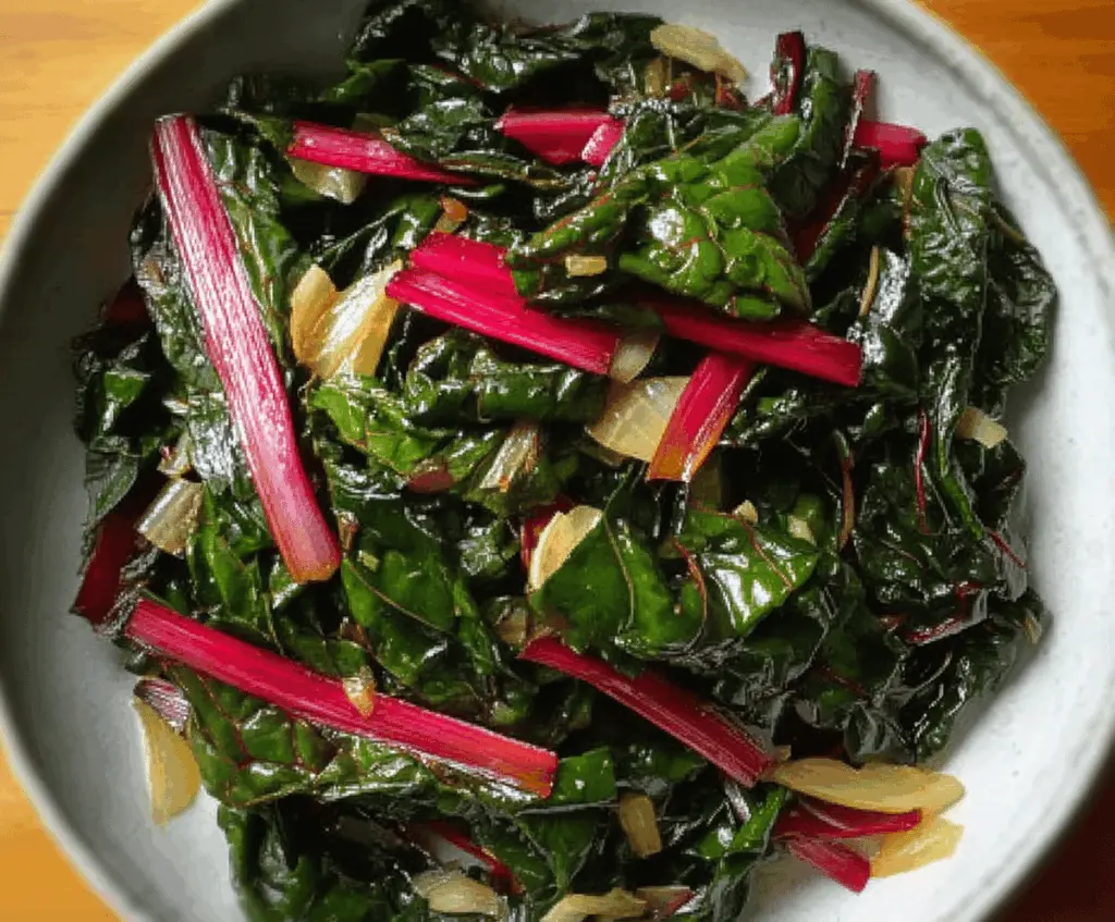 Delicious Swiss Chard cooked with onions and garlic, perfect as a nutritious side dish.