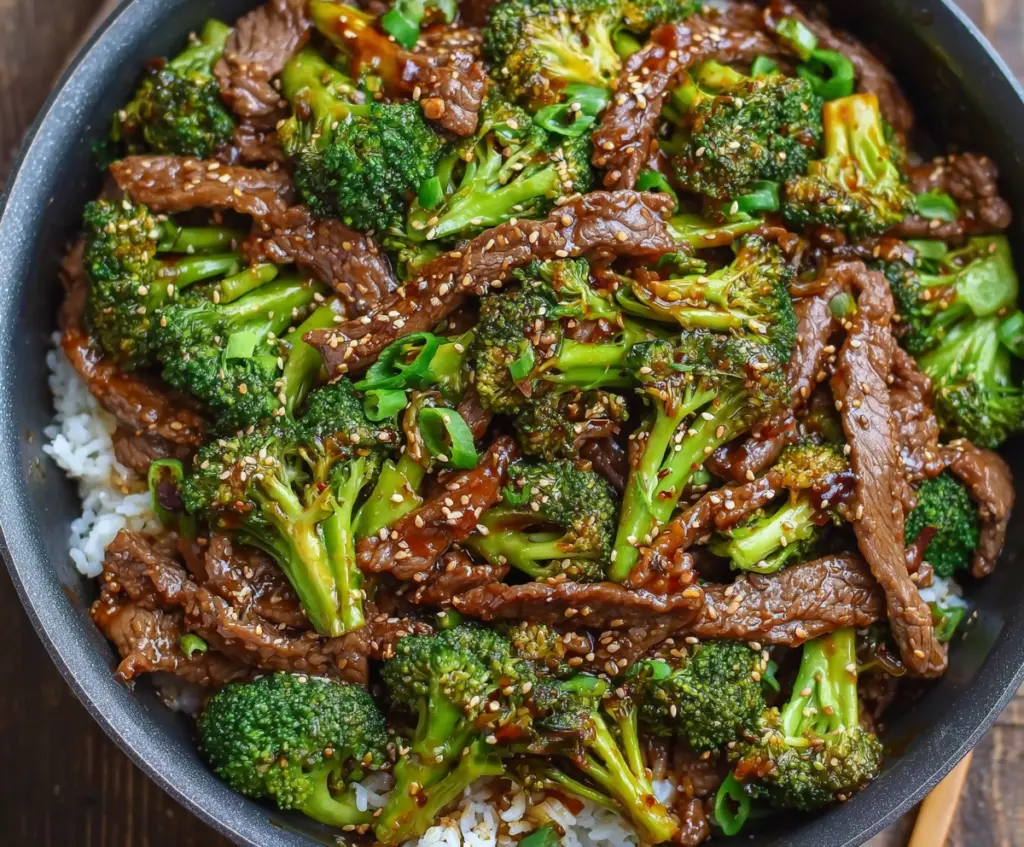 Delicious beef and broccoli stir fry with savory sauce and fresh vegetables on a plate.