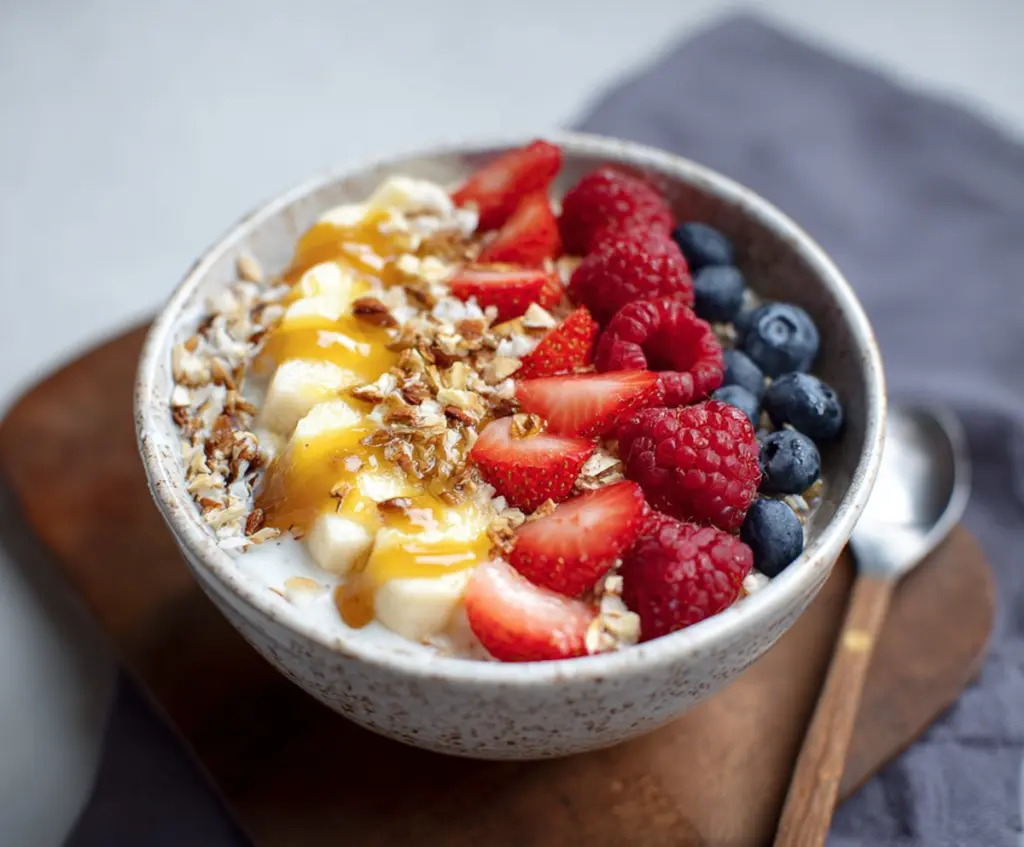 Healthy cottage cheese breakfast bowl topped with fresh fruits and nuts, perfect for a nutritious start to the day.
